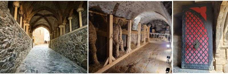 Krivoklat Castle inside, stone vaulted passageway, stylized horses made of straw in the castle underground with rustic stones floor, medieval gothic door in the entrance of Castle Krivoklat
