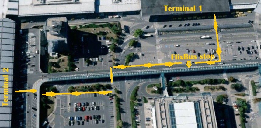 Aerial map of Prague Airport showing yellow walking routes from Terminals 1 and 2 to the FlixBus stop.