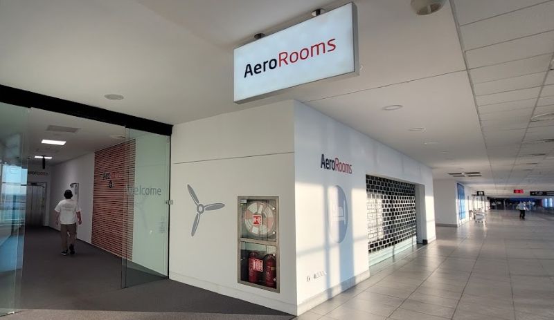 Entrance to the transit-area AeroRooms in the air-side corridor of Terminal 1 at Prague Airport