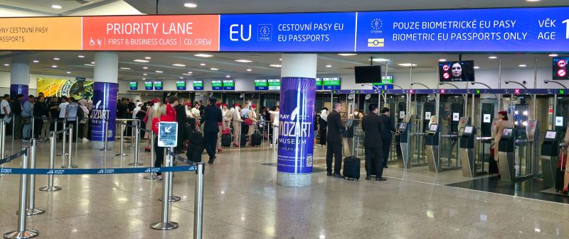 EasyGo automatic passport gates beside staffed passport-control counters at Prague Airport Terminal 1.